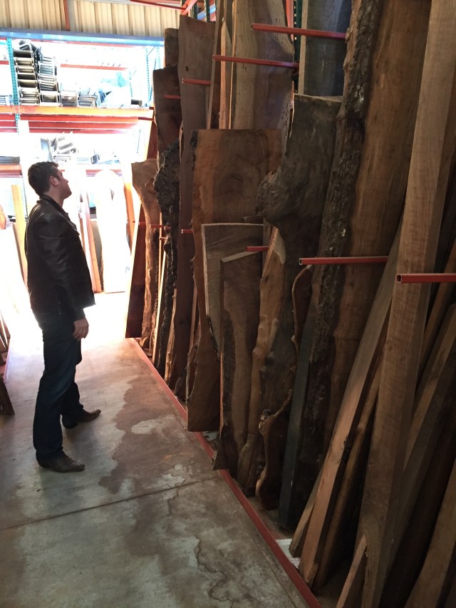 Oliver checking out the wood slabs